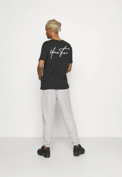 YOURTURN Unisex - Trainingsbroek - Mottled Light Grey -Aanbiedingen Yourturn Winkel 44af697d8af34693a7b3385401313f6d